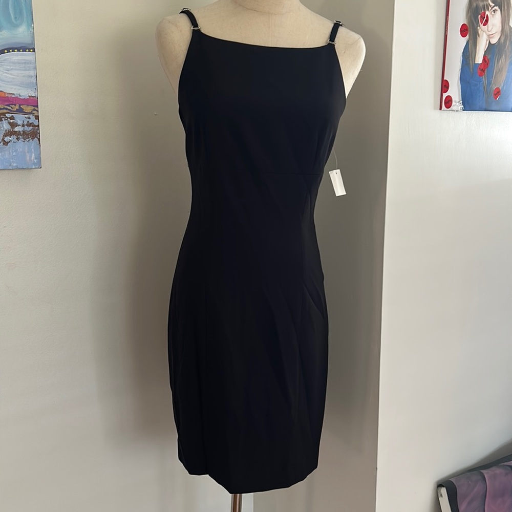 New with tags black cocktail dress. Size 4